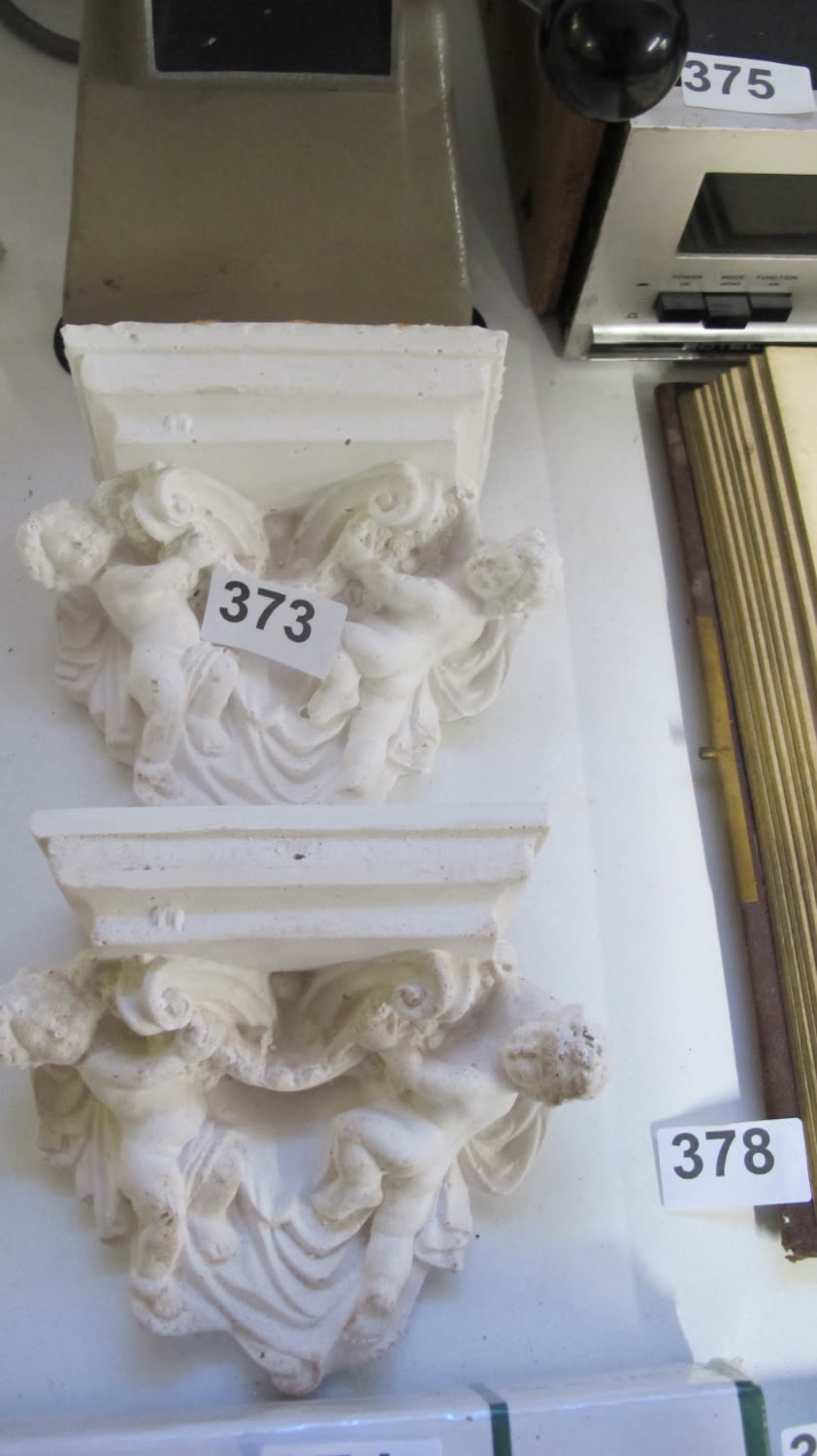 Lot 373: A pair of Cherub corbels dimensions 15 centimetres...