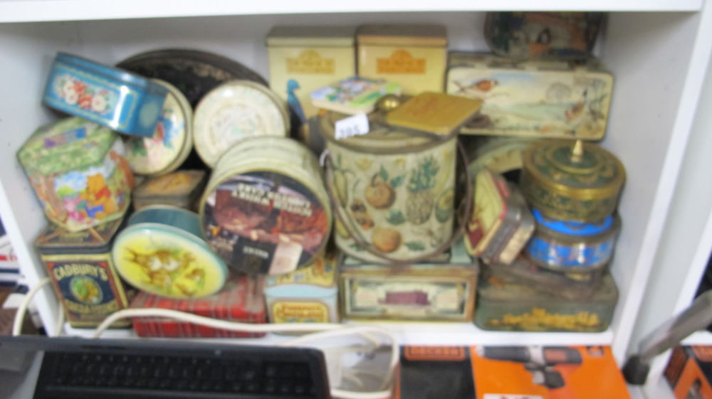 Lot 395: A shelf of vintage tins