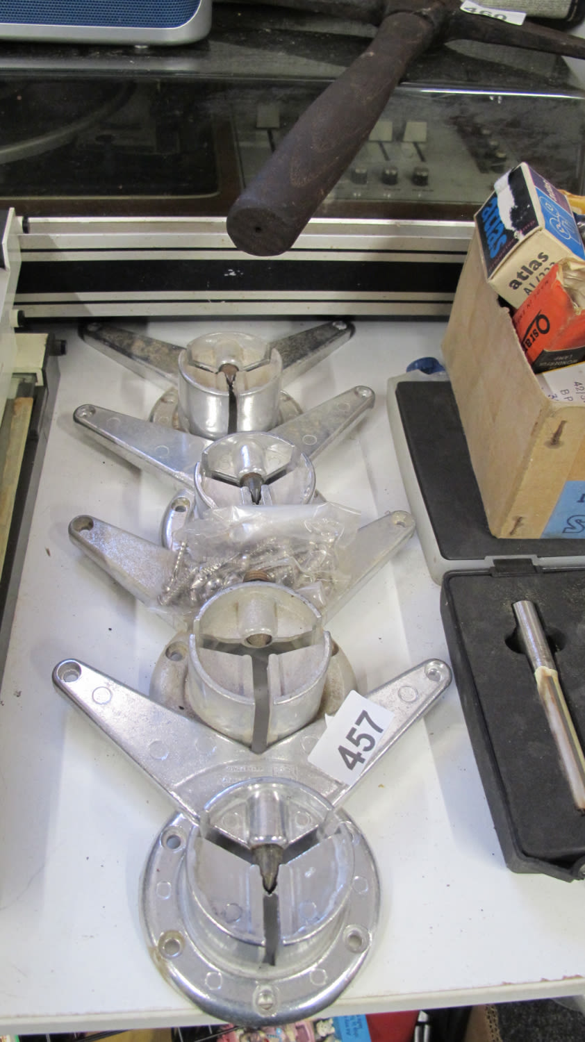 Lot 457: four metal tripod footings