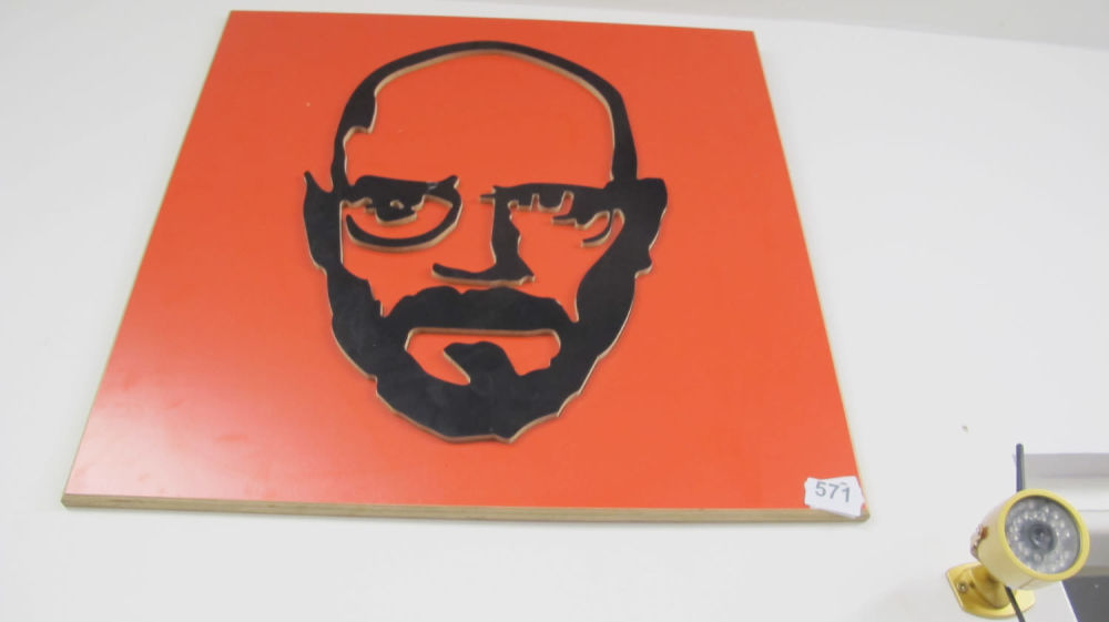 Lot 571: Wooden wall art of Spike Milligan