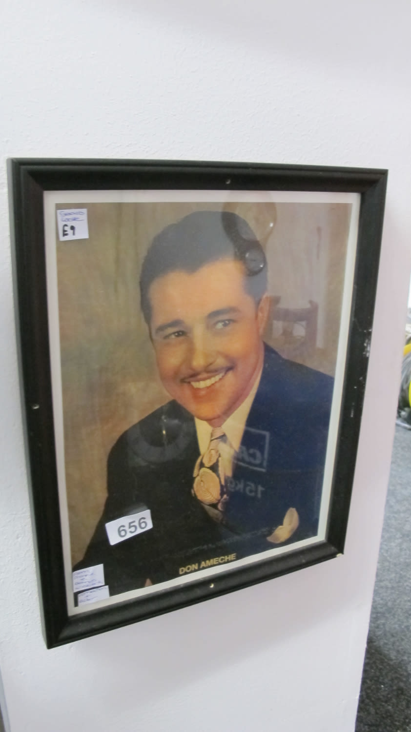 Lot 656: framed and glazed picture from Frankie & Benny's