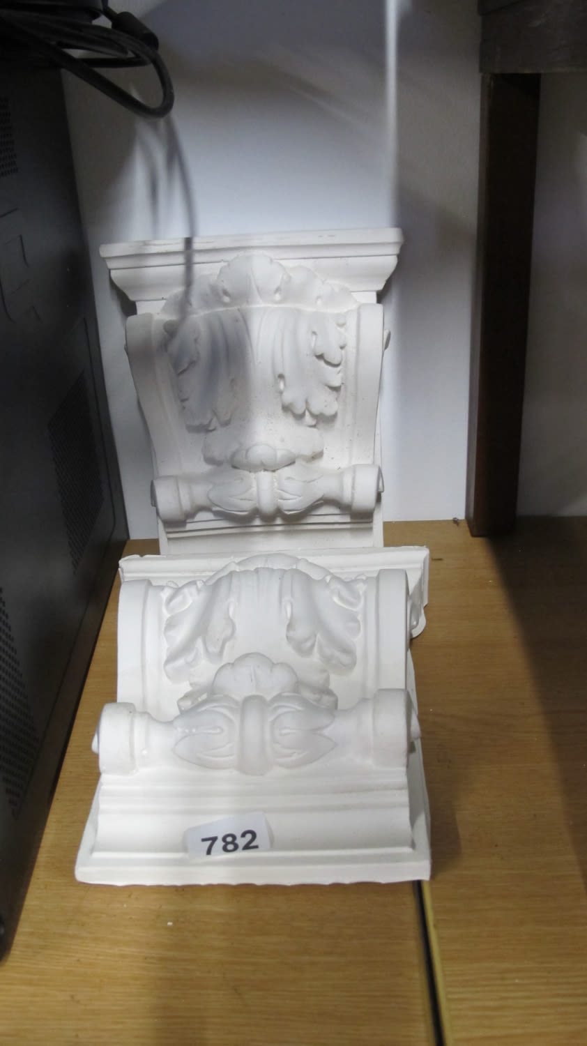 Lot 782: a pair of plaster corbels dimensions are height...