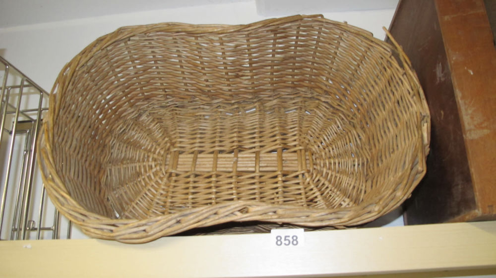Lot 858: A wicker dog bed