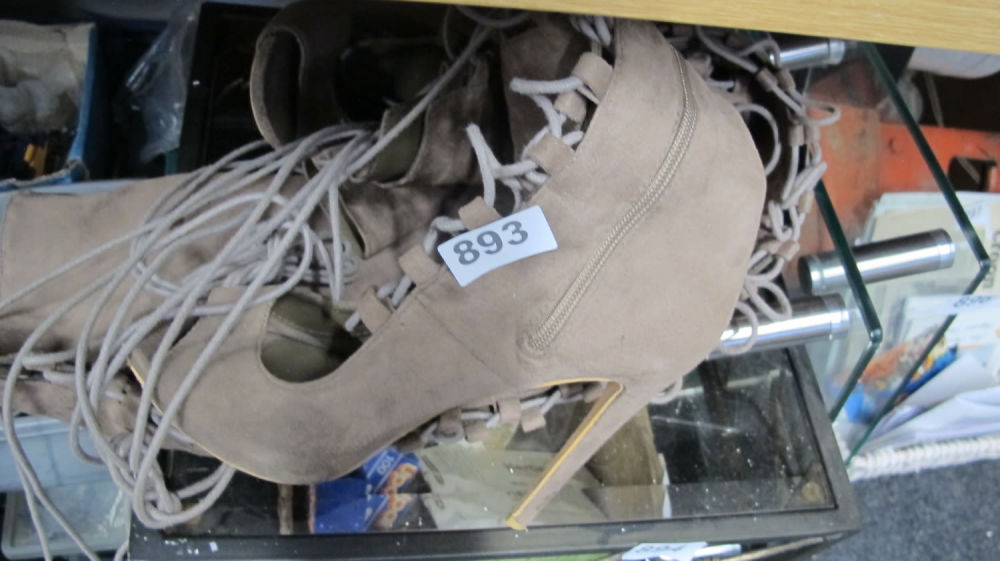 Lot 893: Boots. We've run out of jokes about them...