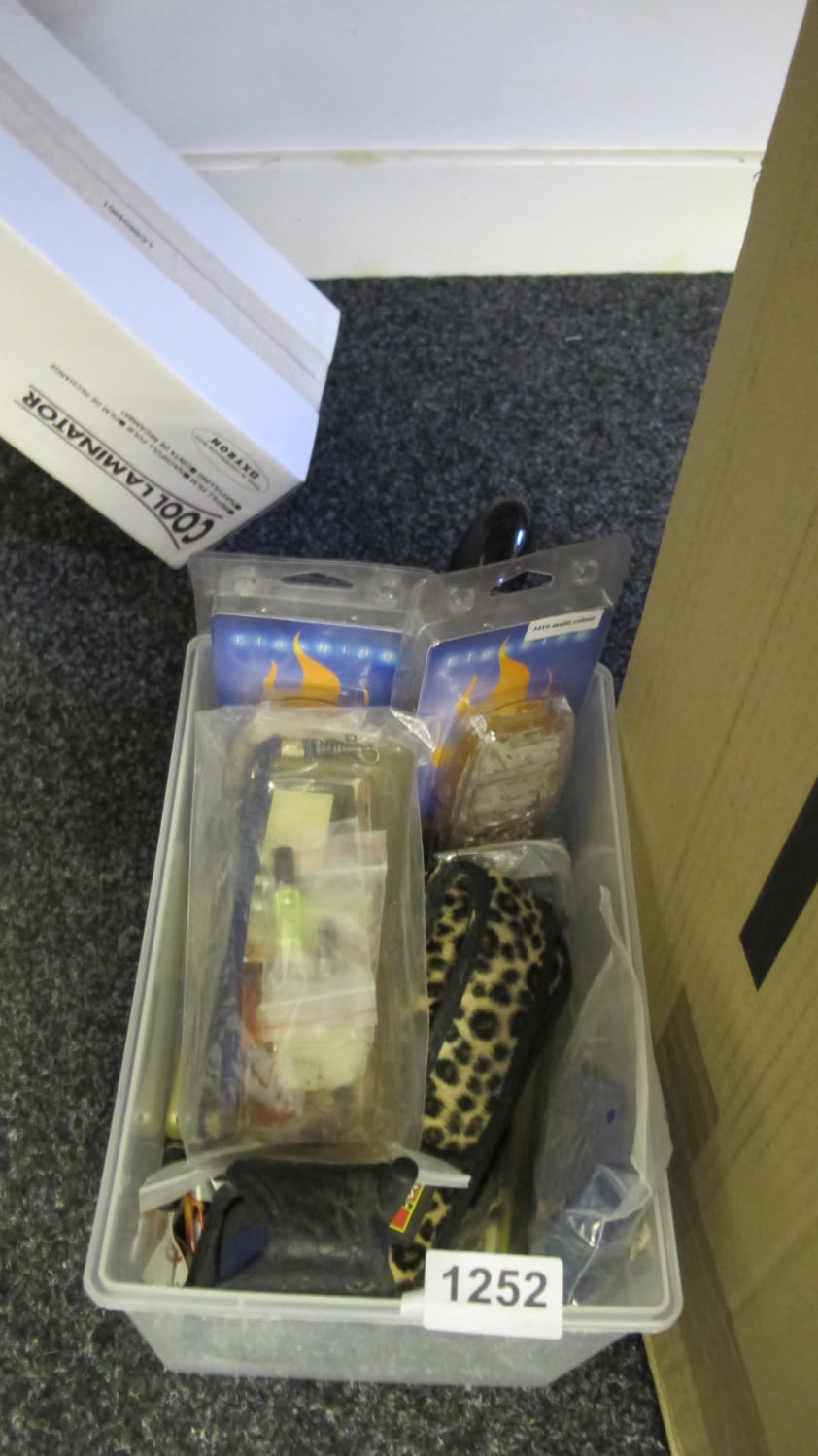 Lot 1252: a box of vintage mobile phone cases