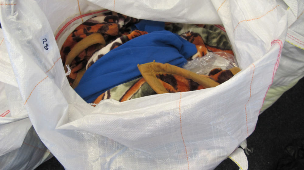 Lot 1280: a large bag of new clothing