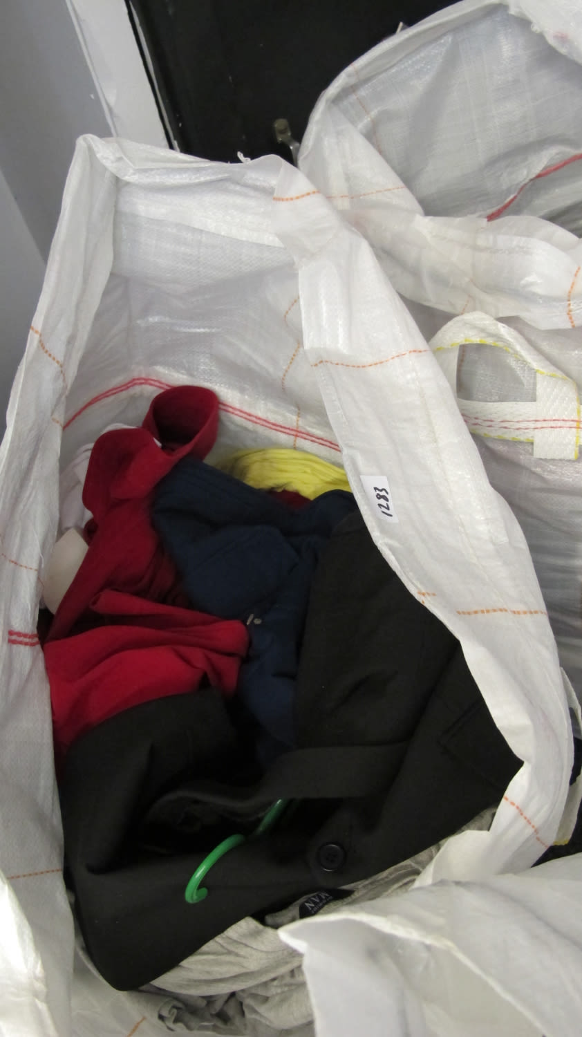 Lot 1283: a large bag of new clothing