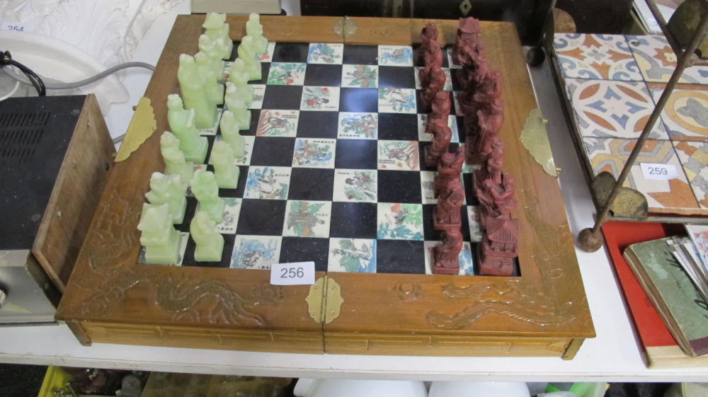 Lot 256: ornate chinese chess set