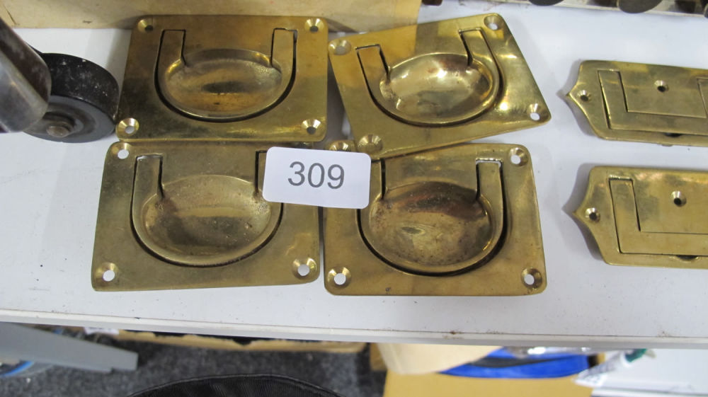 Lot 309: A quantity of antique brass handles