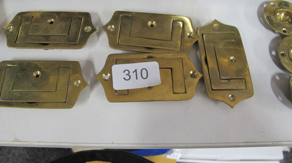 Lot 310: A quantity of antique brass handles