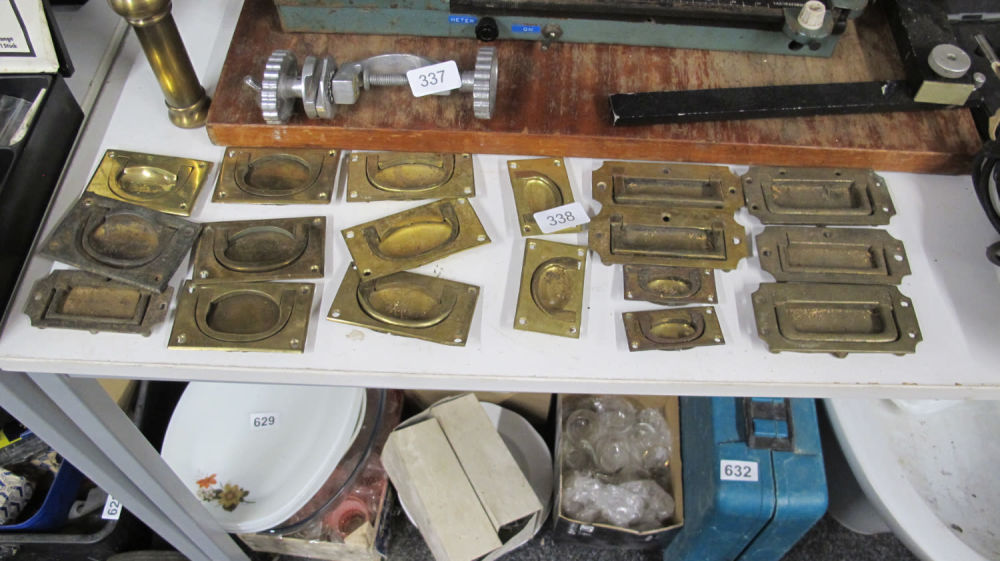 Lot 338: A quantity of antique brass handles