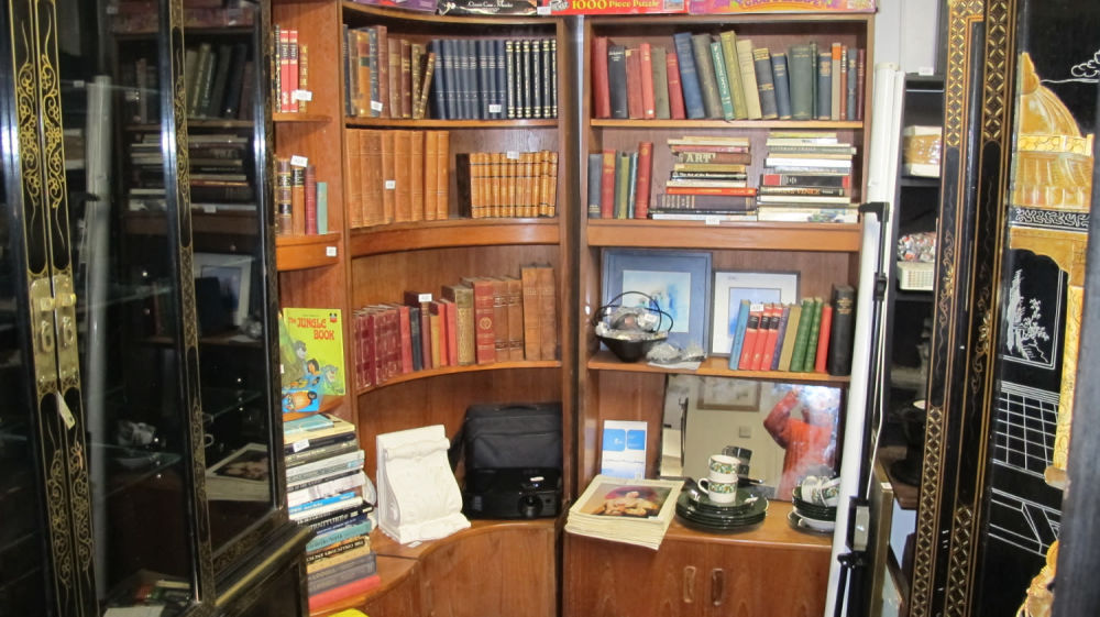 Lot 421: Stunning mid-century corner bookshelves and cupboards