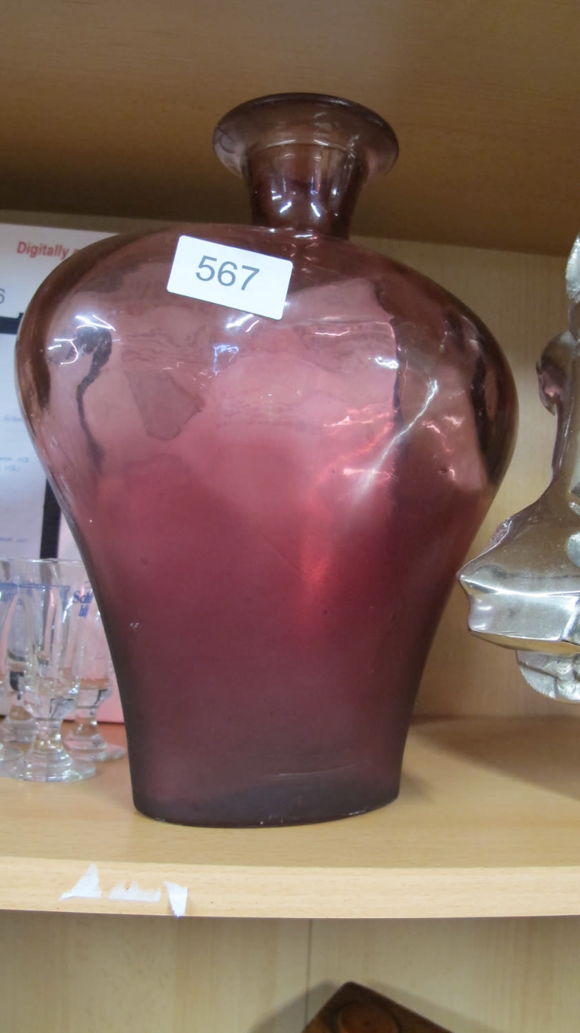 Lot 567: Red glass bottle vase
