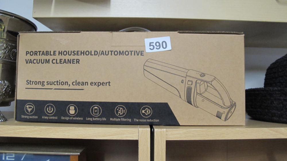 Lot 590: Hand held rechargable car vacuum cleaner
