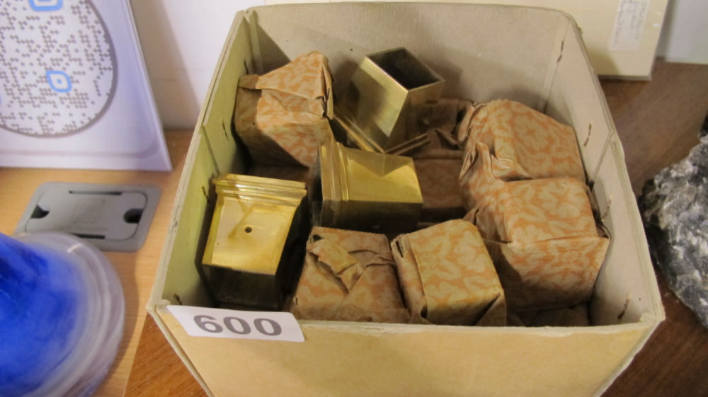 Lot 600: Brass fittings to cap the base of furniture...