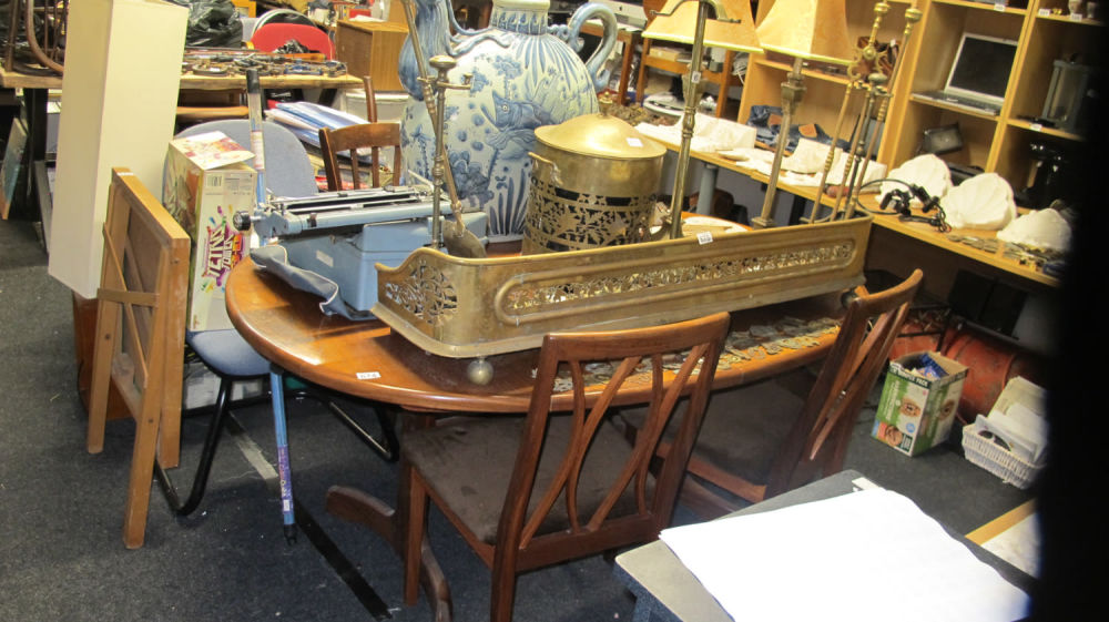 Lot 674: Dining table and chair