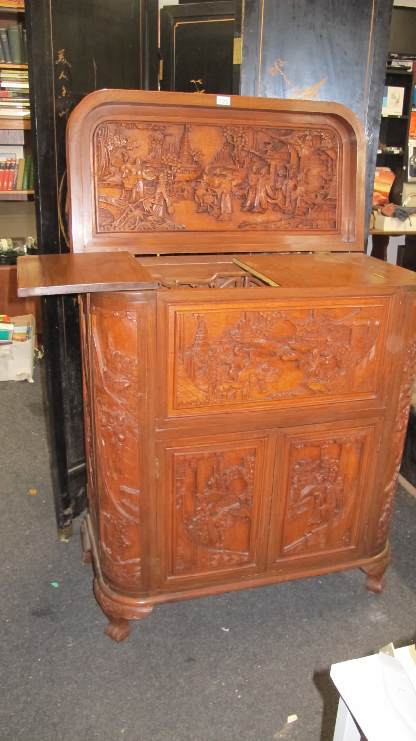 Lot 725: Heavily carved Hong Kong drinks cabinet