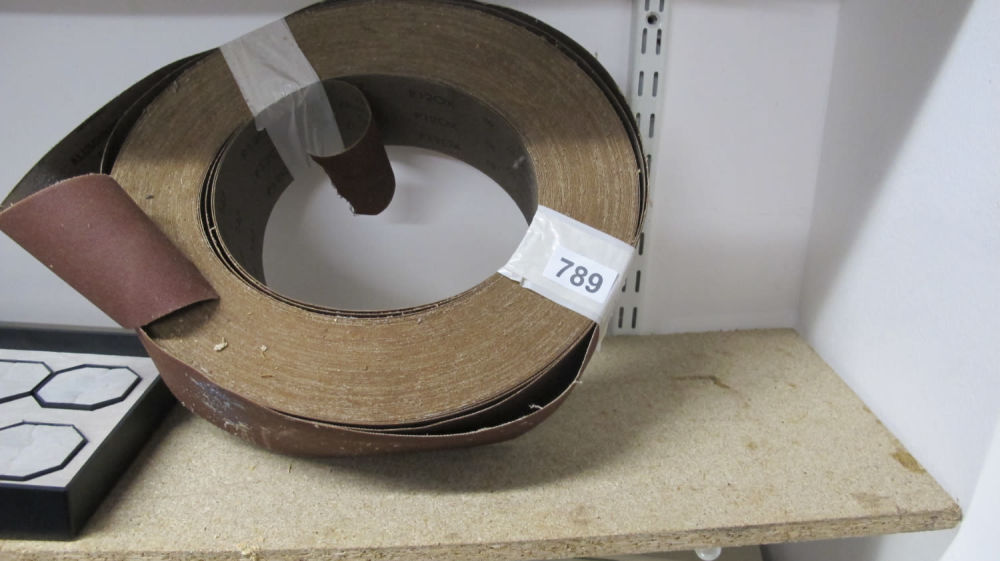 Lot 789: A roll of abrasive sand paper for a...