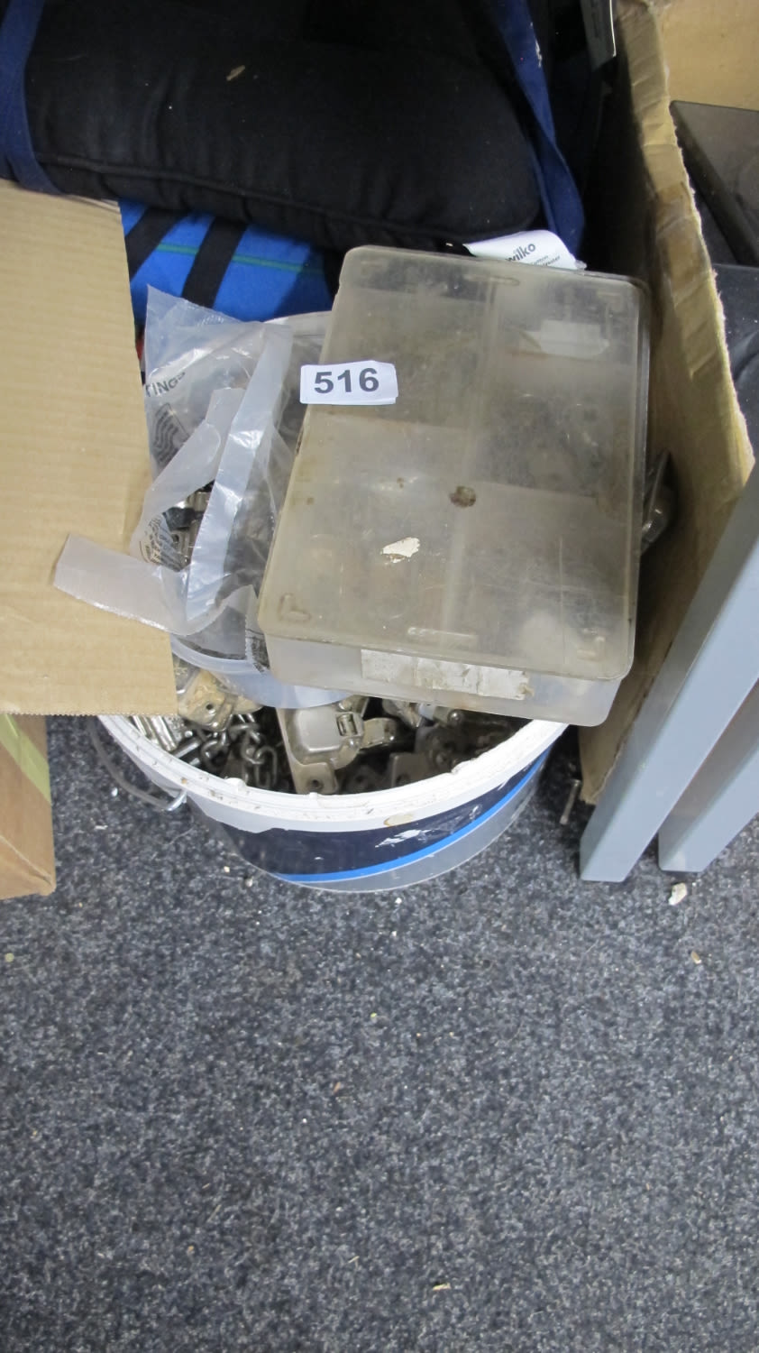 Lot 516: Tub of cupboard hinges etc