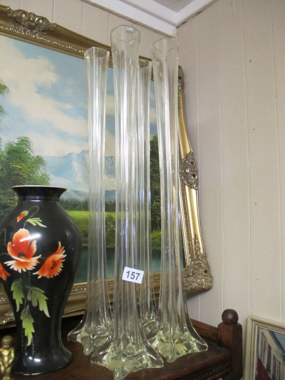Lot 157: A collection of tall glass stem vases