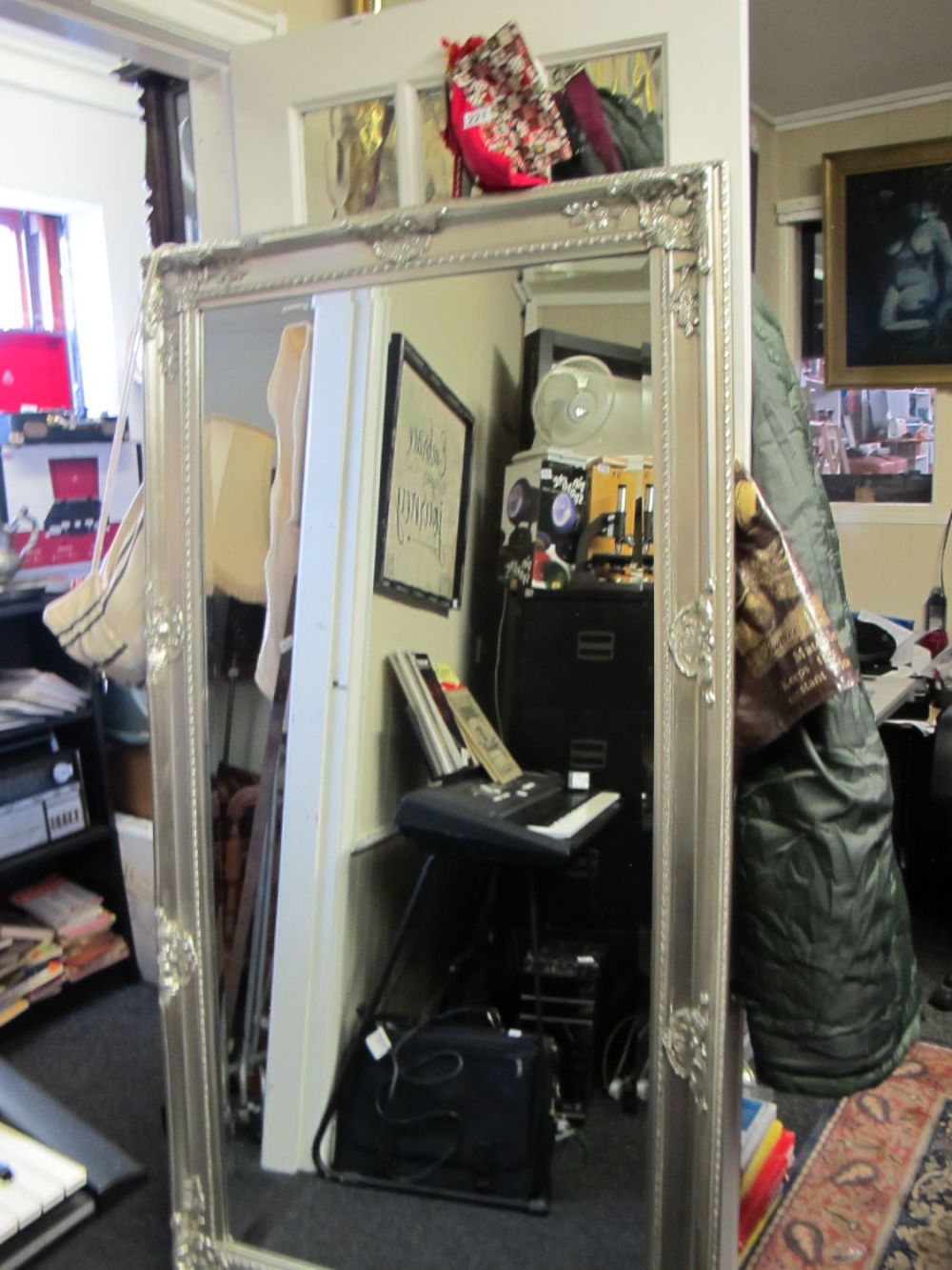 Lot 219: Very large ornate silver framed mirror