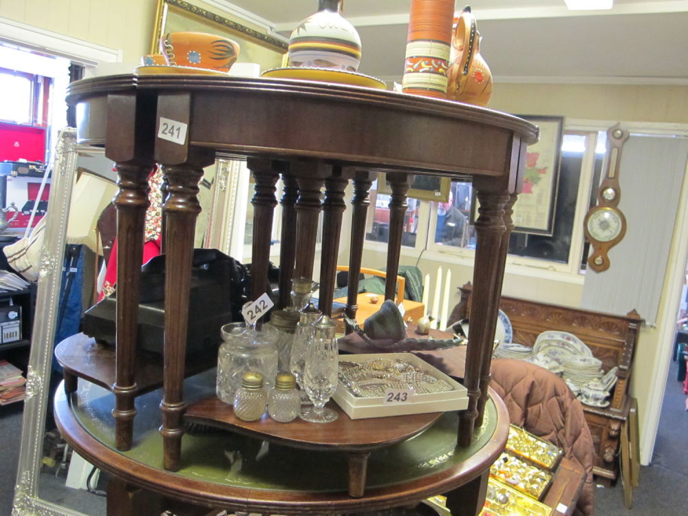 Lot 241: Circular leather topped nest of tables