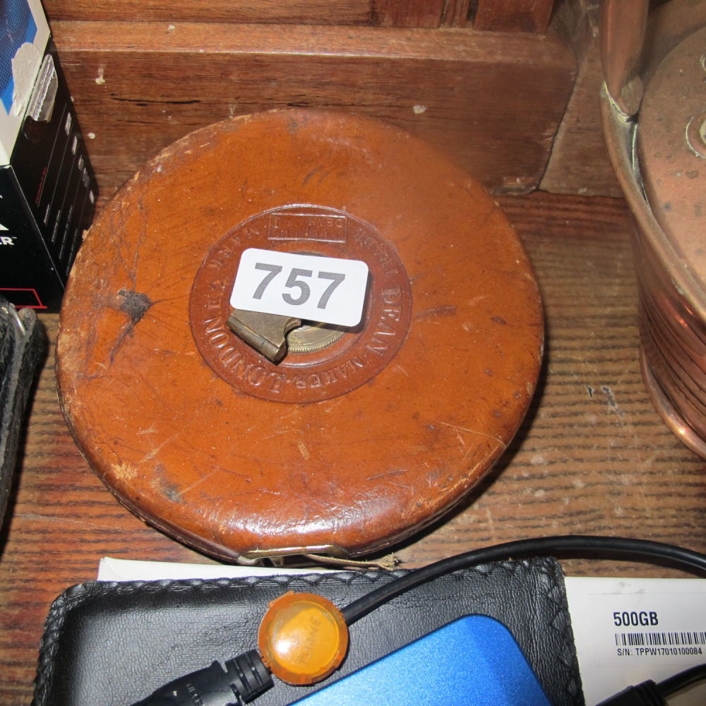 Lot 757: leather bound tape measure