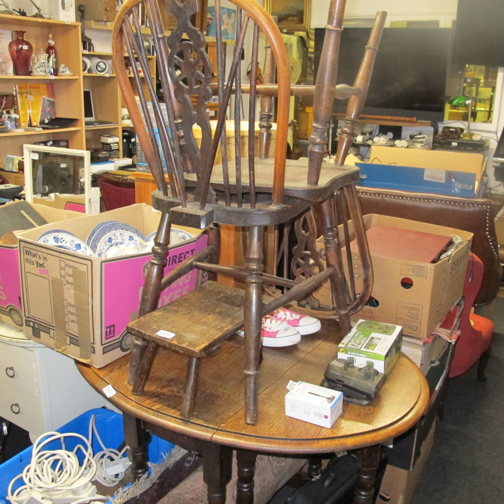 Lot 966: Round table and wheelback chairs