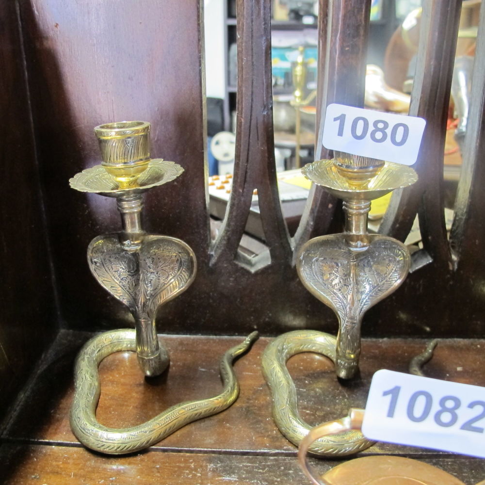 Lot 1080: Brass cobra candlesticks