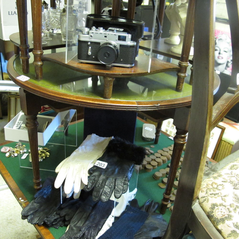 Lot 202: Leather and glass topped round table with four...