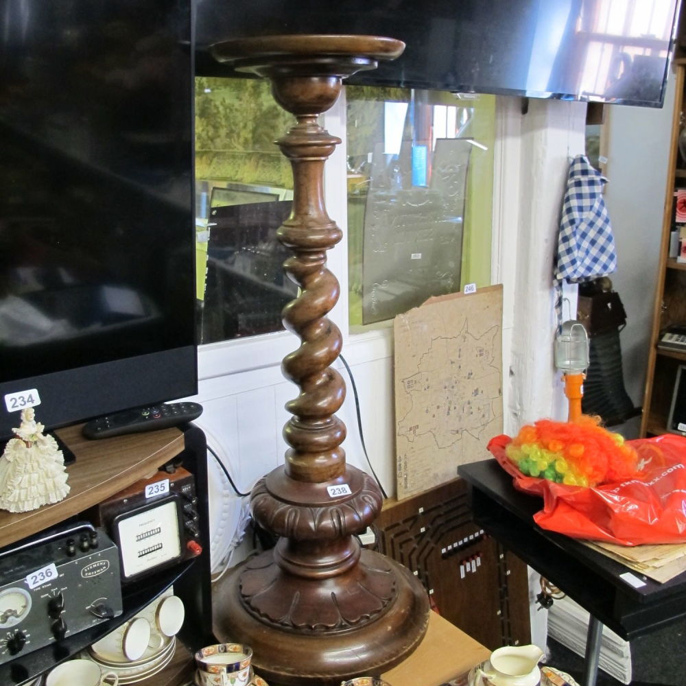 Lot 238: A large wooden candlestick