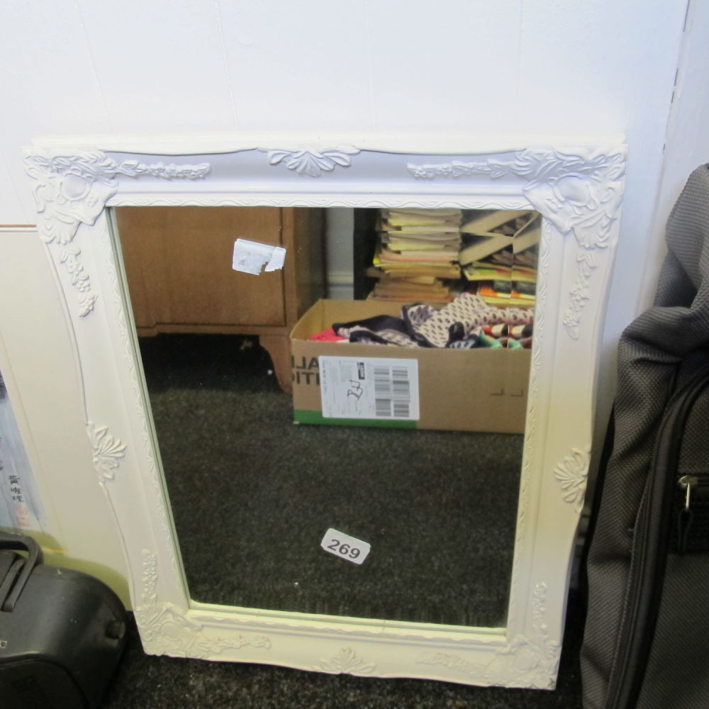 Lot 269: A small ornate wooden framed mirror