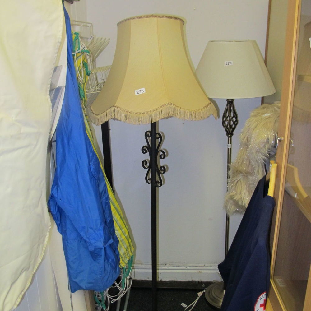 Lot 273: A wrought iron standard lamp and shade