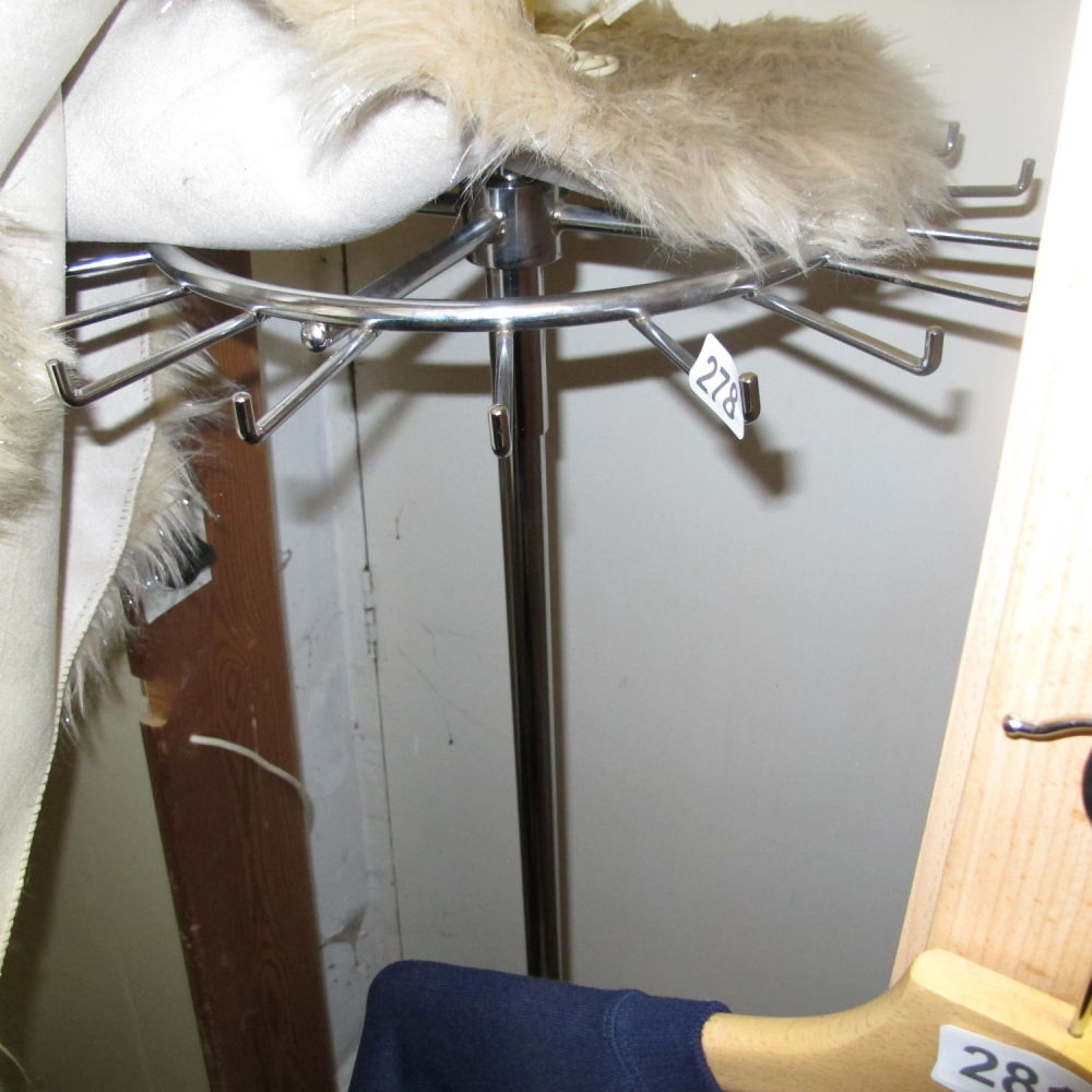 Lot 278: a stainless steel spinning shop merchandise display rack