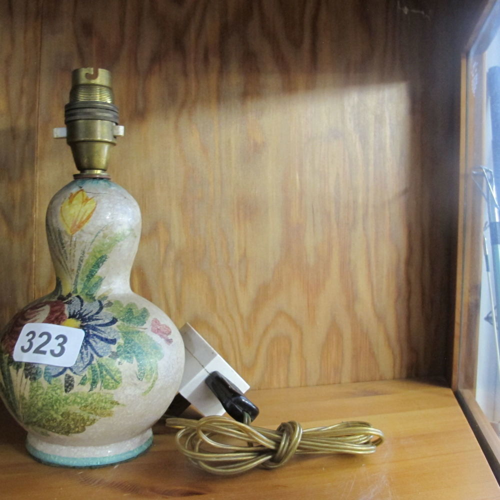 Lot 323: Ornate floral pottery lamp