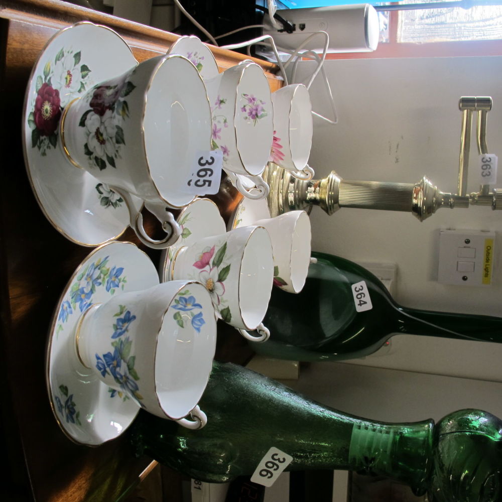 Lot 365: A set of six large teacups and matching...