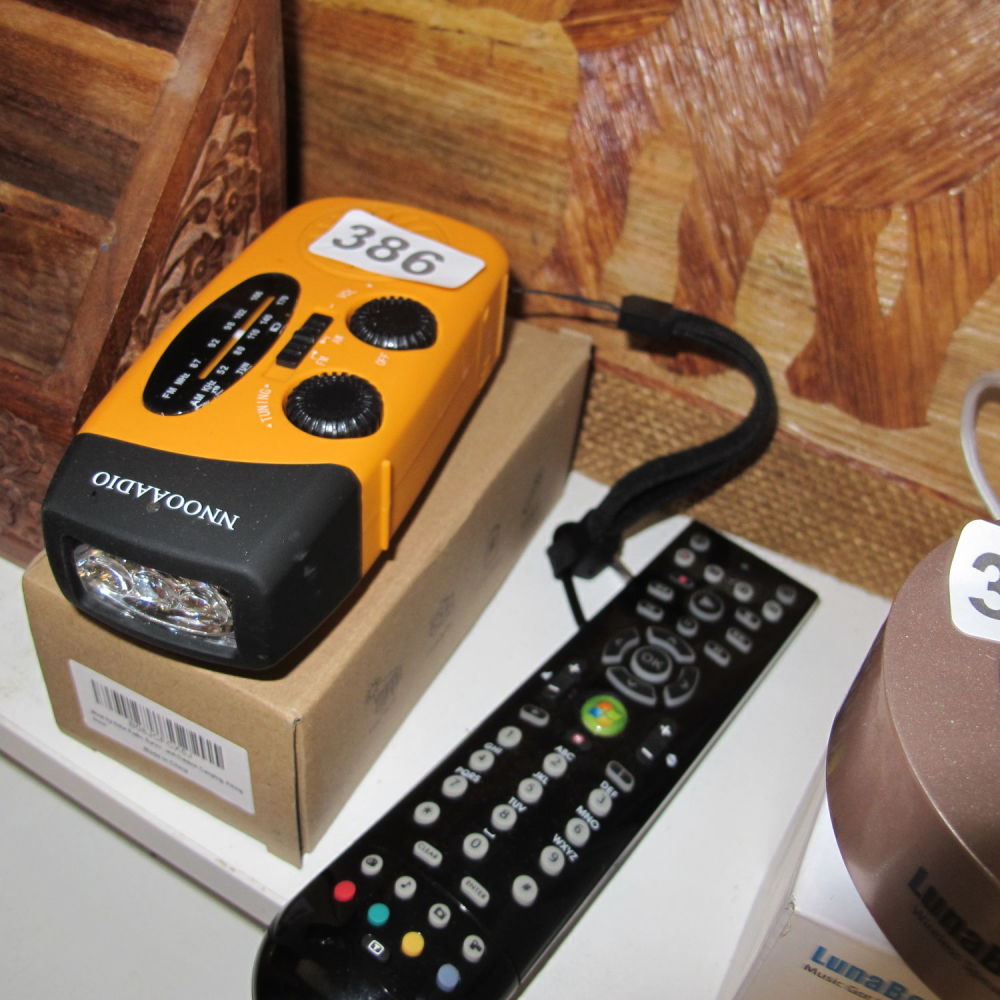 Lot 386: NNOOAADIO wind up radio and torch with solar...