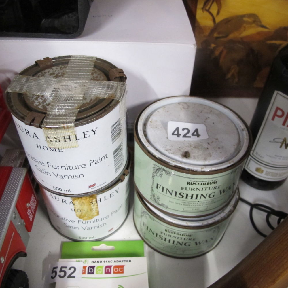 Lot 424: two unopened tins of laura ashley satin furniture...