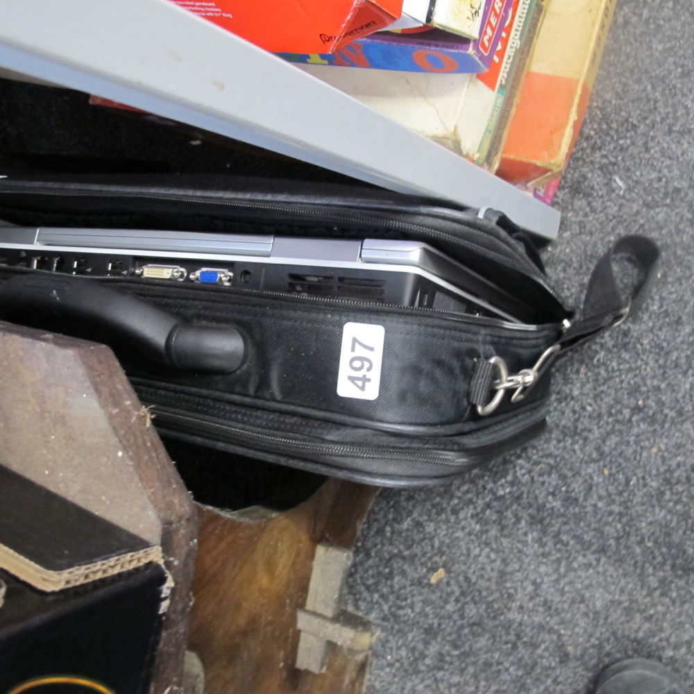 Lot 497: a holdall with a dell laptop