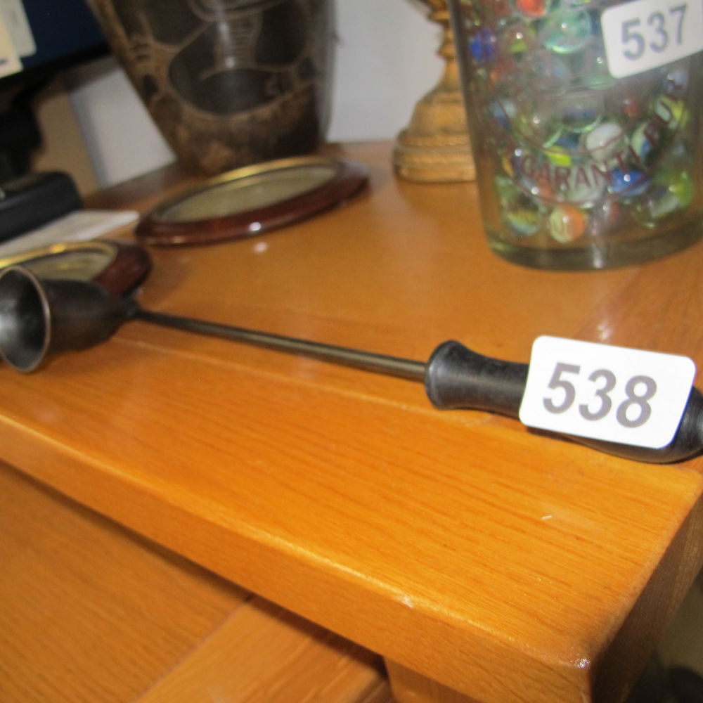 Lot 538: a candle snuffer