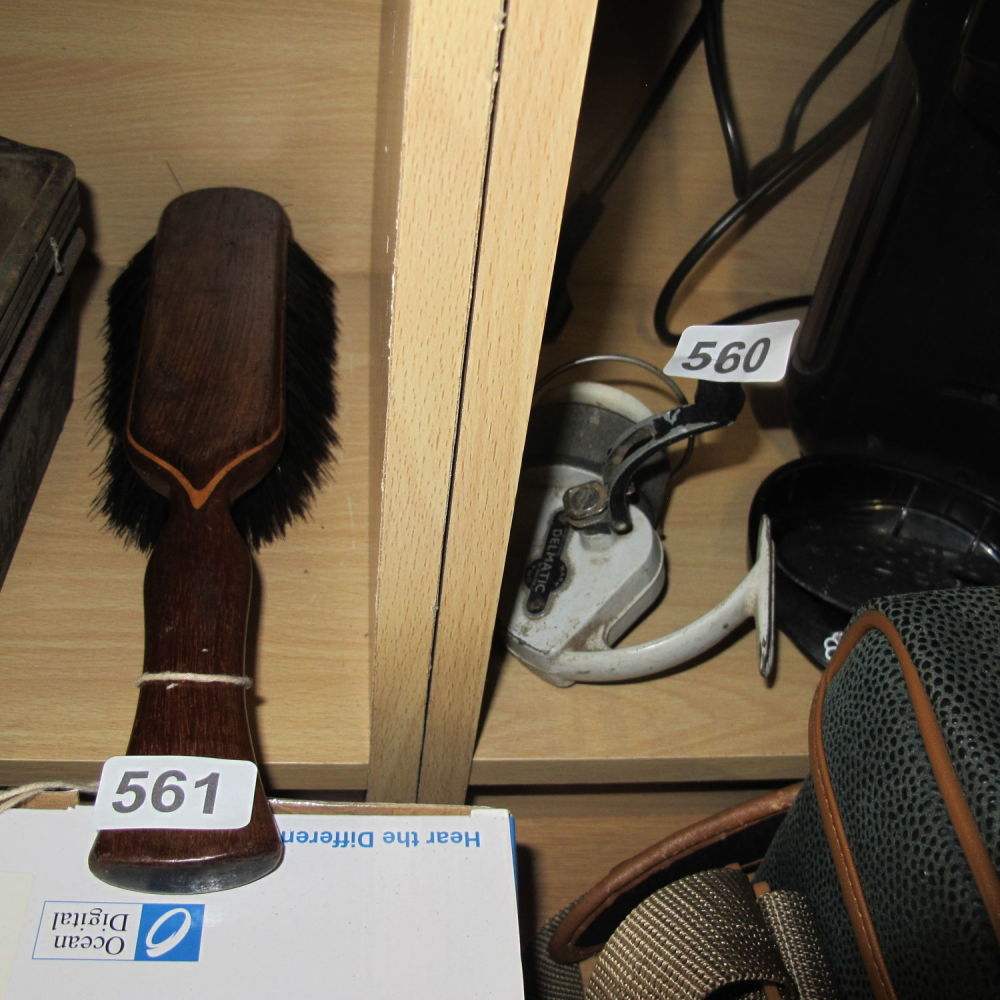 Lot 561: a large clothing brush