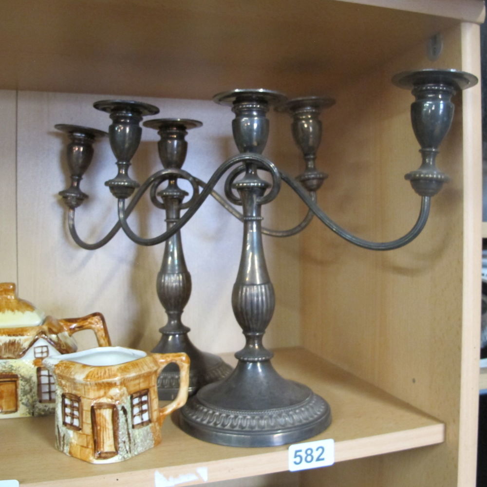 Lot 582: Pair of silver candelabras