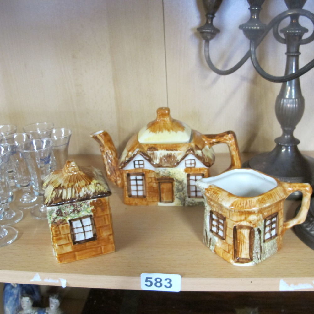 Lot 583: Three piece cottage ware tea set