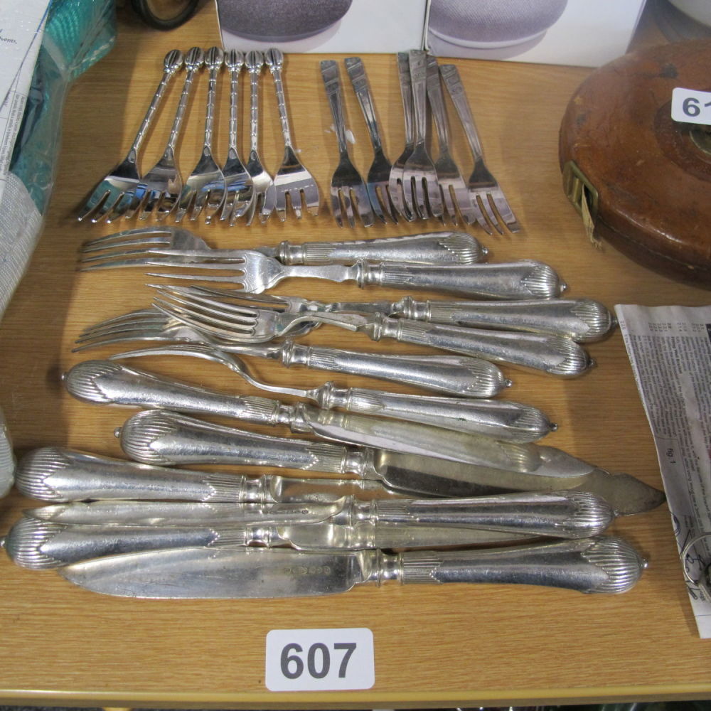 Lot 607: A collection of cake forks and ornate cutlery