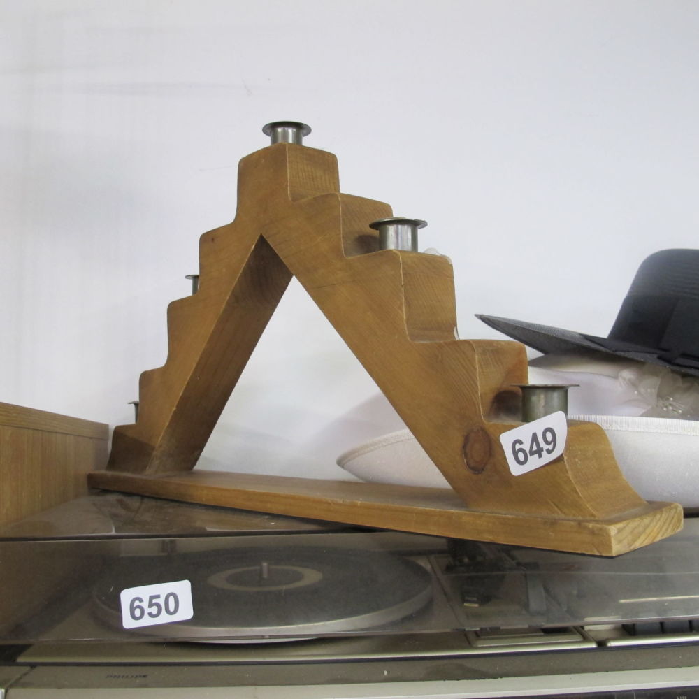 Lot 649: A wooden table center piece candle holder