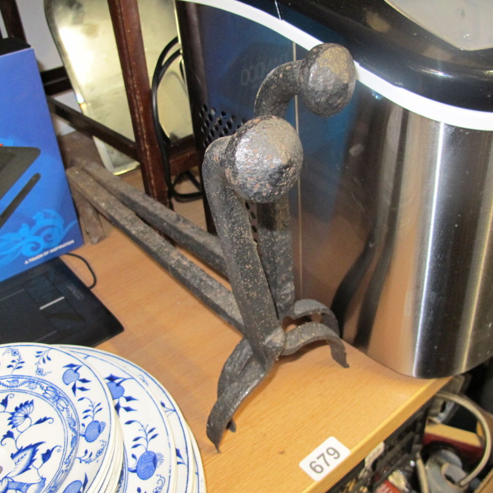 Lot 679: Pair of antique wrought iron fire side dogs