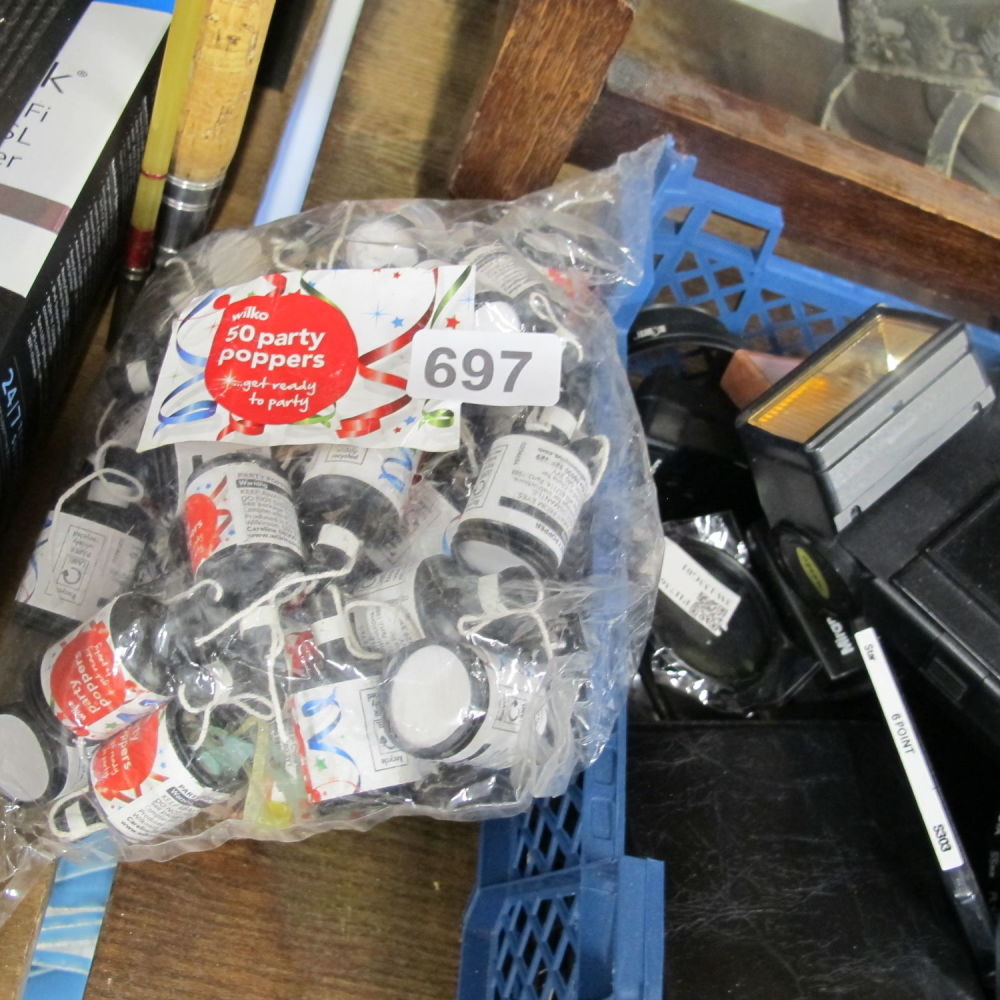 Lot 697: Packet of 50 party poppers