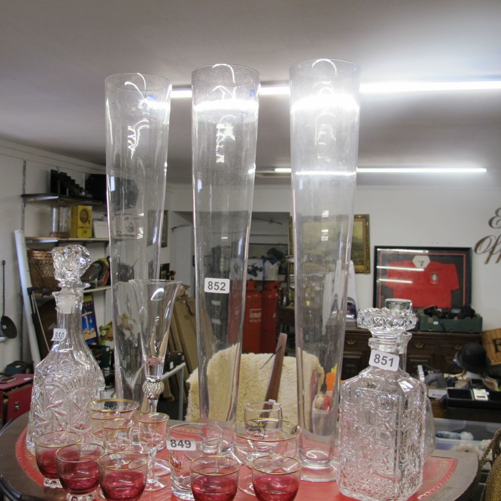 Lot 852: Three tall glass vases 
