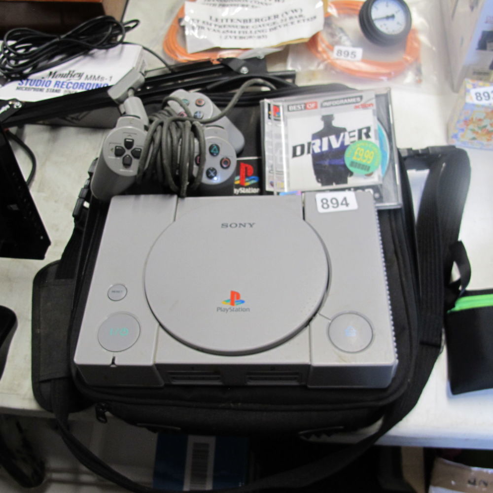 Lot 894: PlayStation with bag, driver game and two controllers