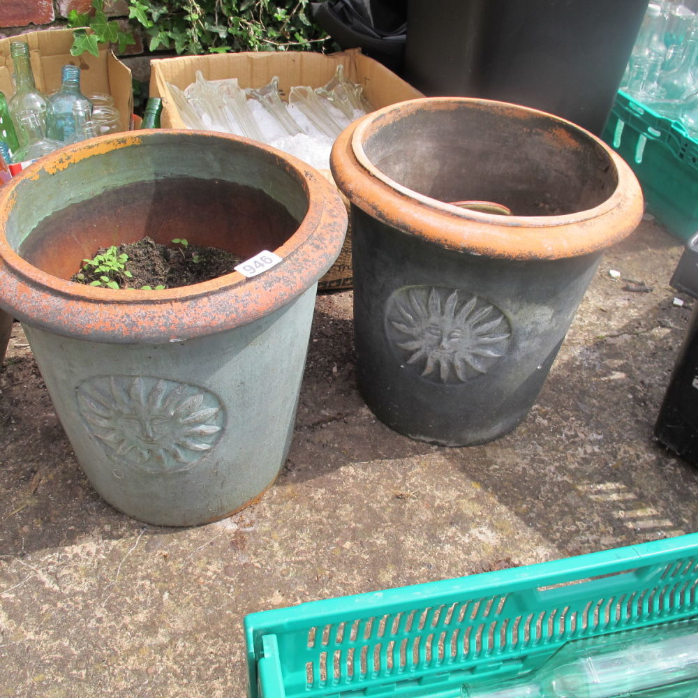 Lot 946: Two sun motif garden planters 